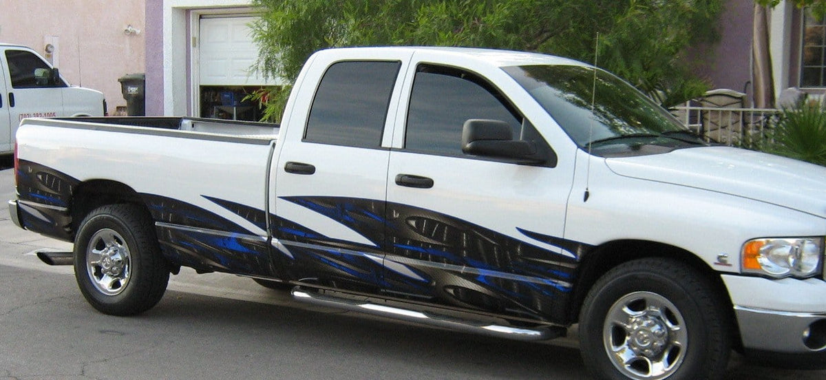 tribal carbon fiber wave wrap on white truck